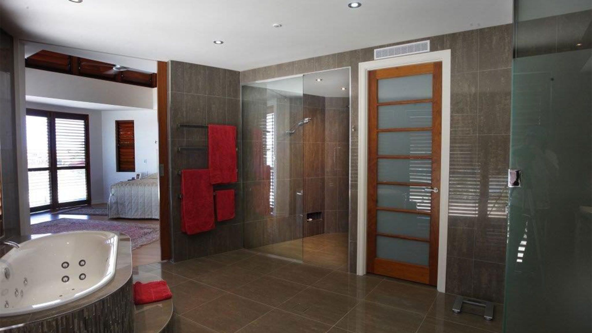 A Bathroom With Two Sinks And A Walk In Shower — Frameless Shower Installations, Sunshine Coast