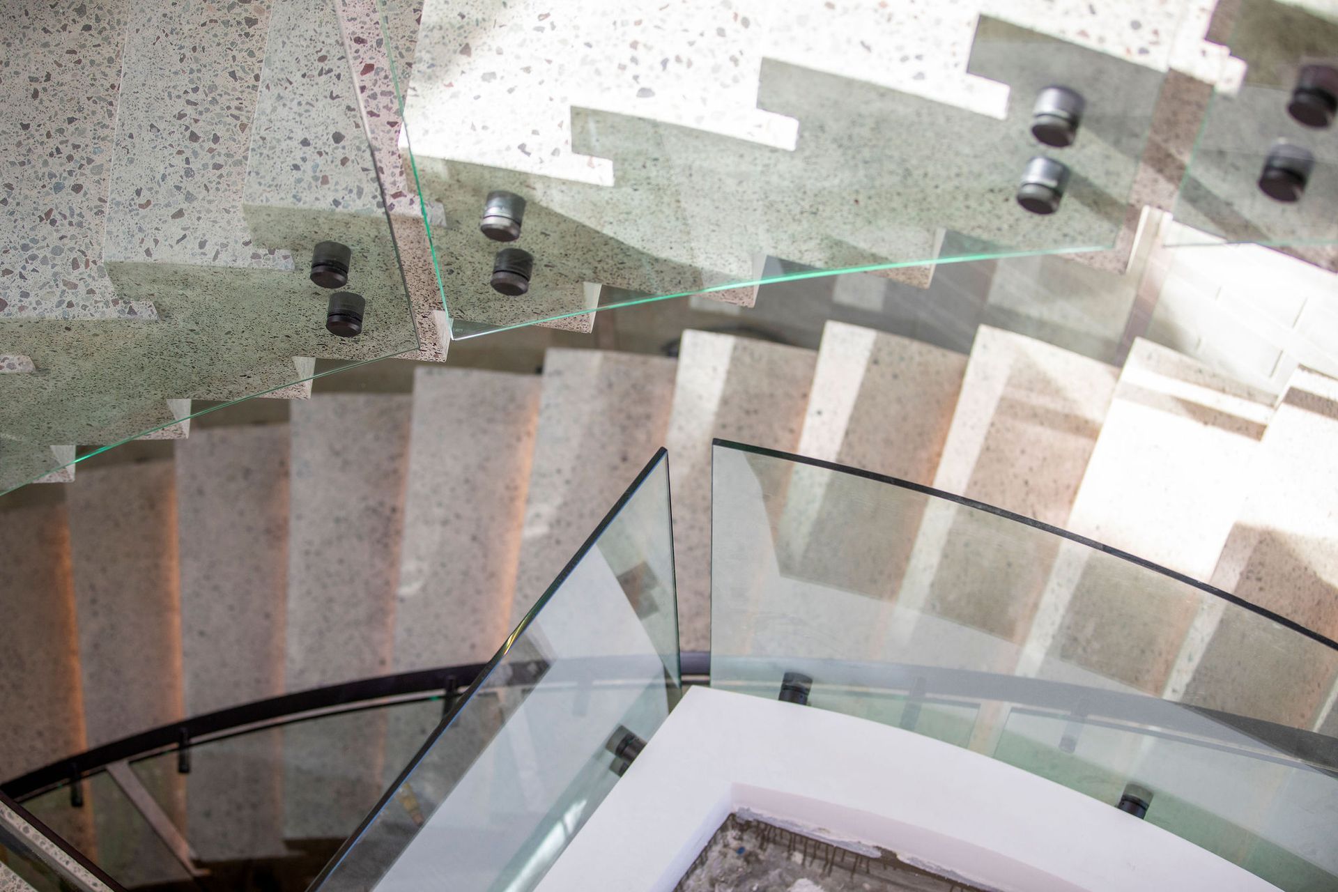 A Staircase With a Glass Railing and a Wooden Floor — Frameless Shower Installations In Maroochydore, QLD