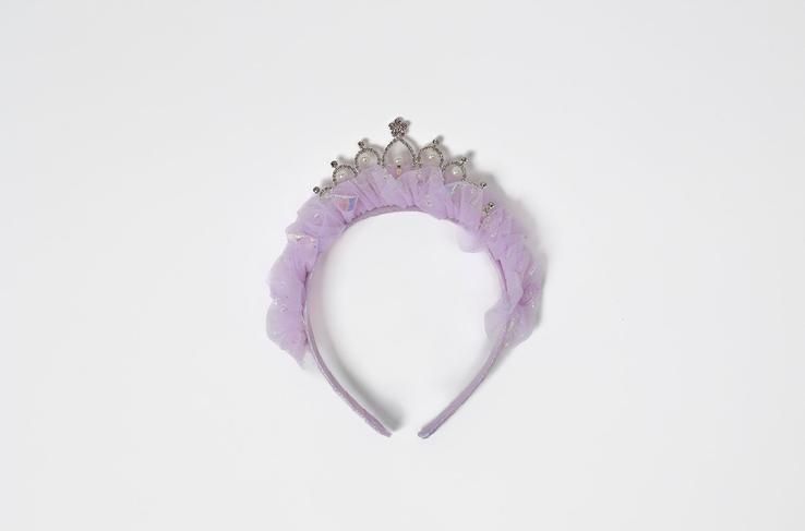A purple headband with a crown on it on a white background.