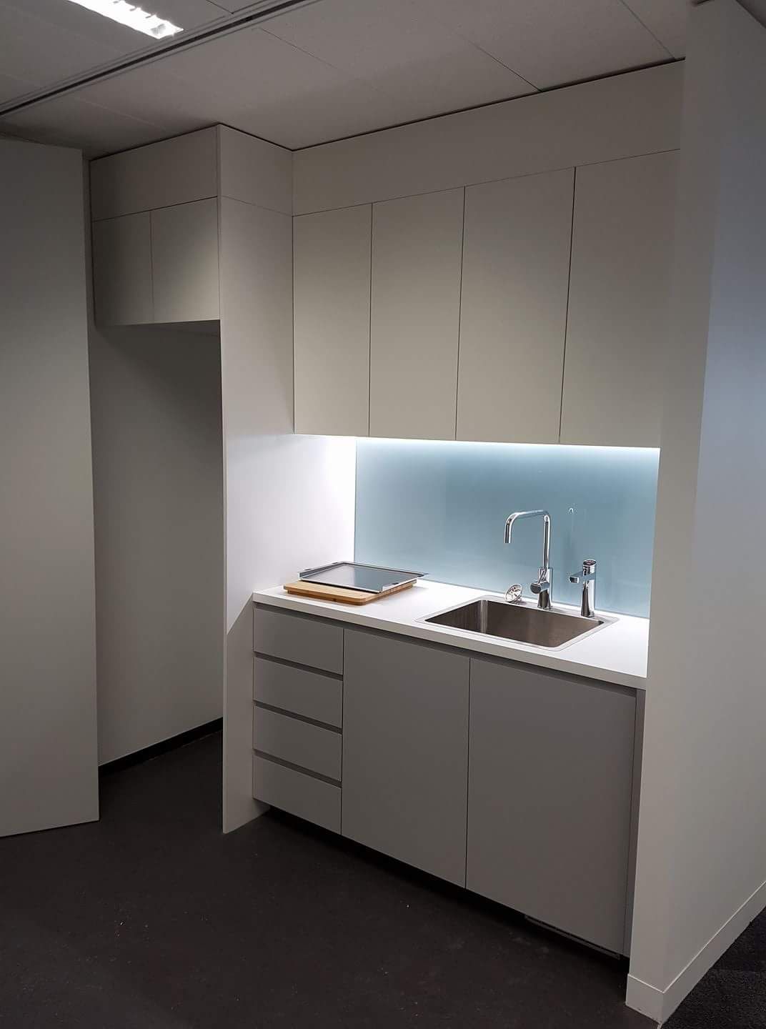 A Kitchen with White Cabinets and A Sink — Sheridan Stone Aust in Toormina, NSW
