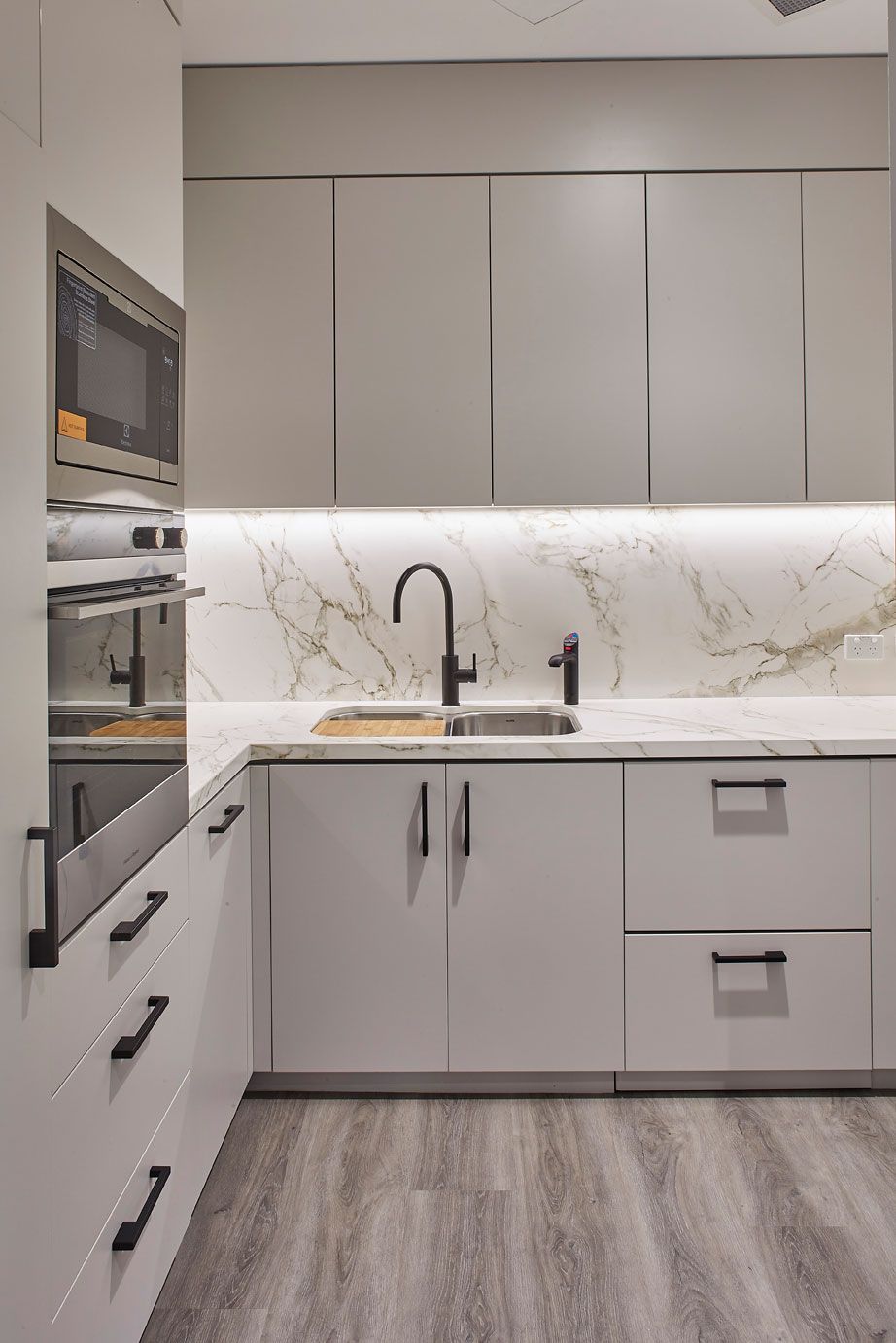 A Kitchen with White Cabinets, a Sink, and A Microwave — Sheridan Stone Aust in Toormina, NSW