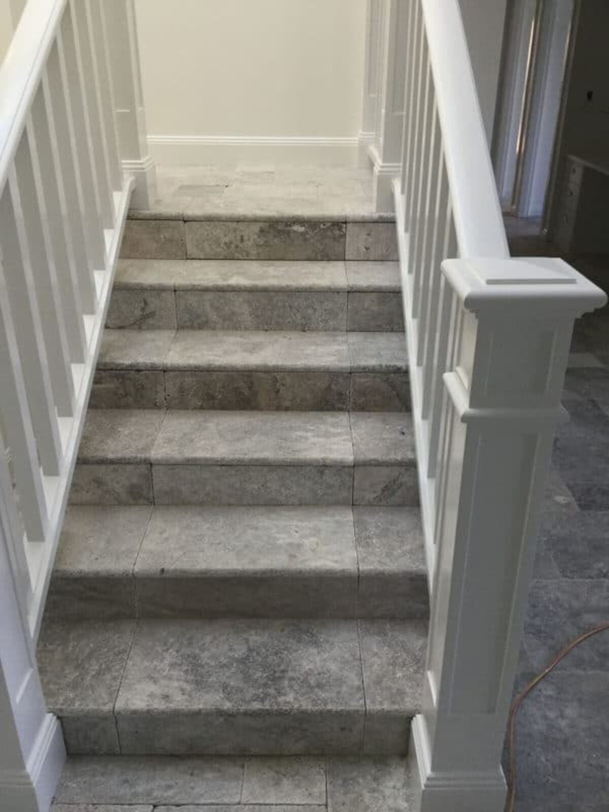 A Set of Stairs with A White Railing in A House — Sheridan Stone Aust in Kempsey, NSW