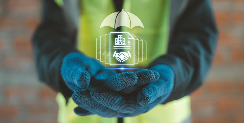 Gloved hands holding a glowing house icon under an umbrella, symbolizing home insurance or protection