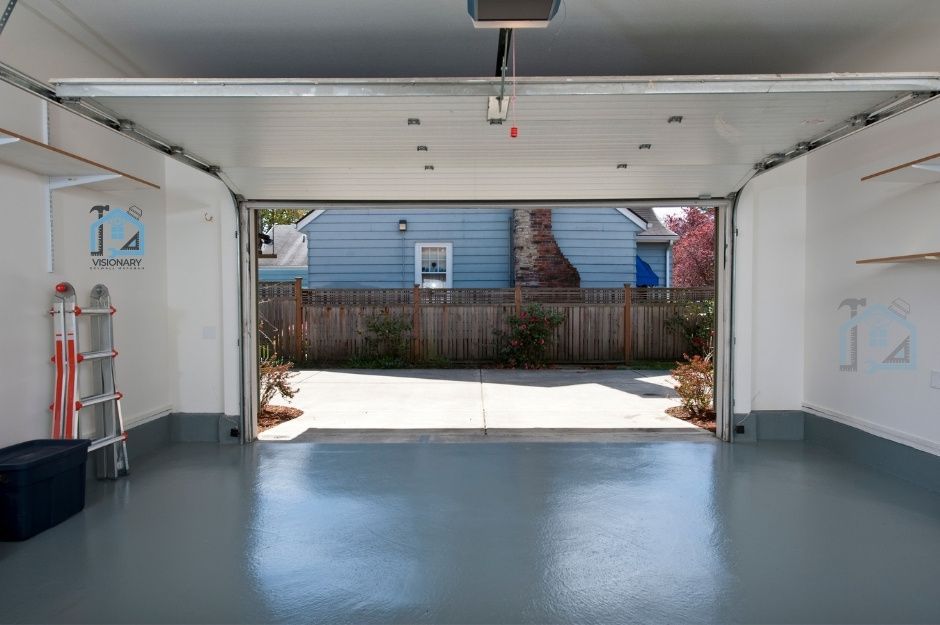 Newly installed drywall in a garage with painted walls and floor located in Markham, Ontario.