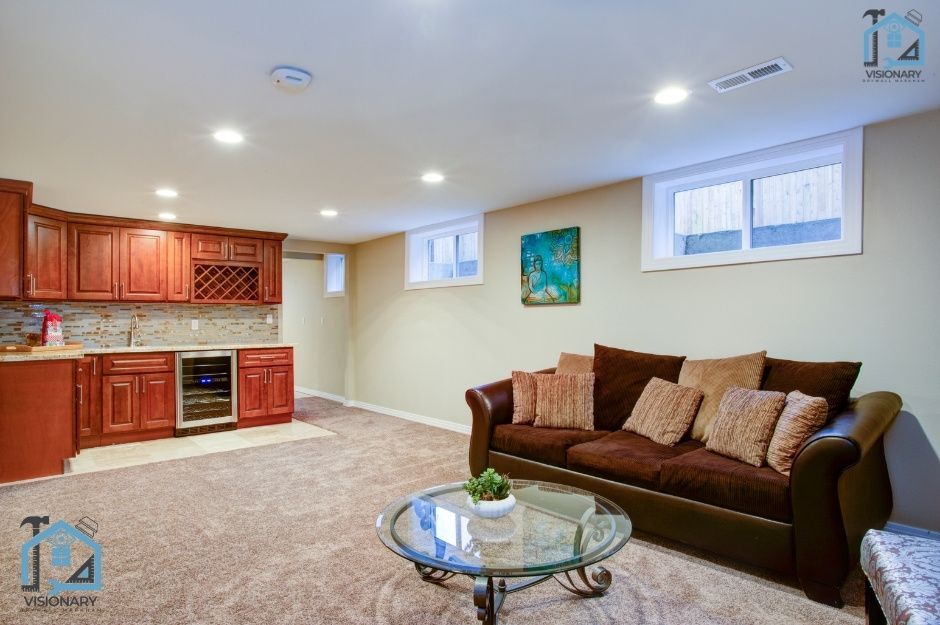 Picture featuring a finished drywall basement installation project with a kitchen and a living room area that was completed in Markham, Ontario