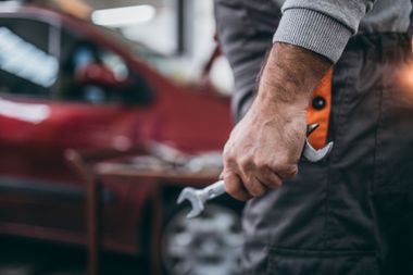 Mechanic Holding Wrench — Auto Service & Repair in Logan, OH Mechanic Holding Wrench — Auto Service & Repair in Logan, OH
