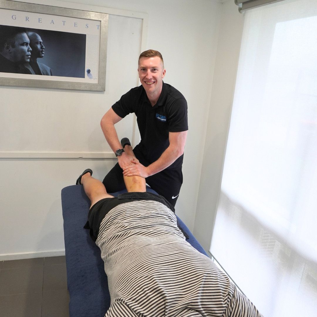 Man is Helping a Client — Return to Performance Physiotherapy in Epsom, VIC