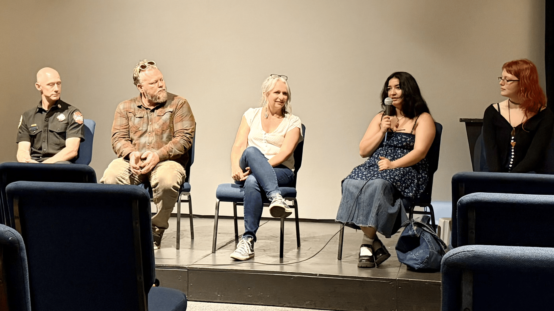 Guest panelists speak about their experiences with wildfire after a showing of the movie Embers of Awakening: From Firestorms to Climate Healing at Sparking Action