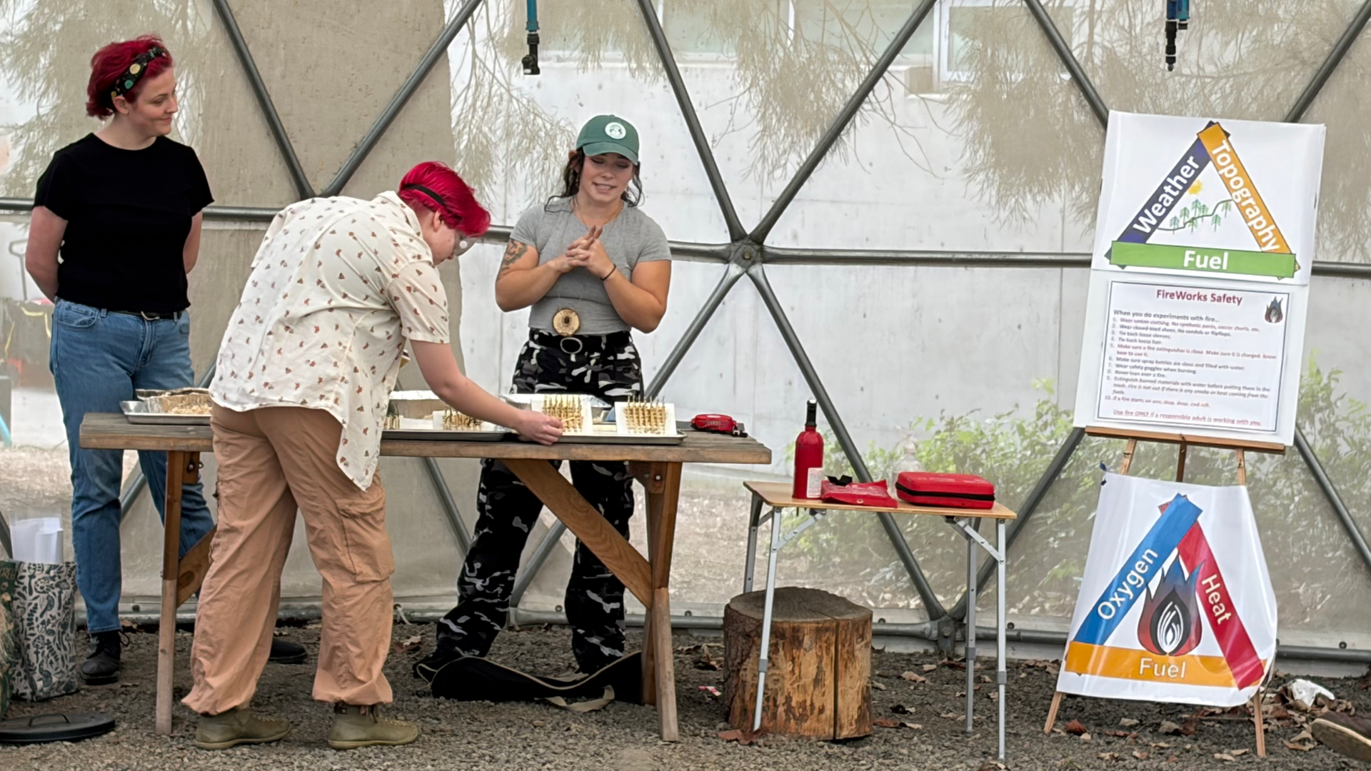 SOFRC educators perform a fire science demonstration in the ScienceWorks Dome.