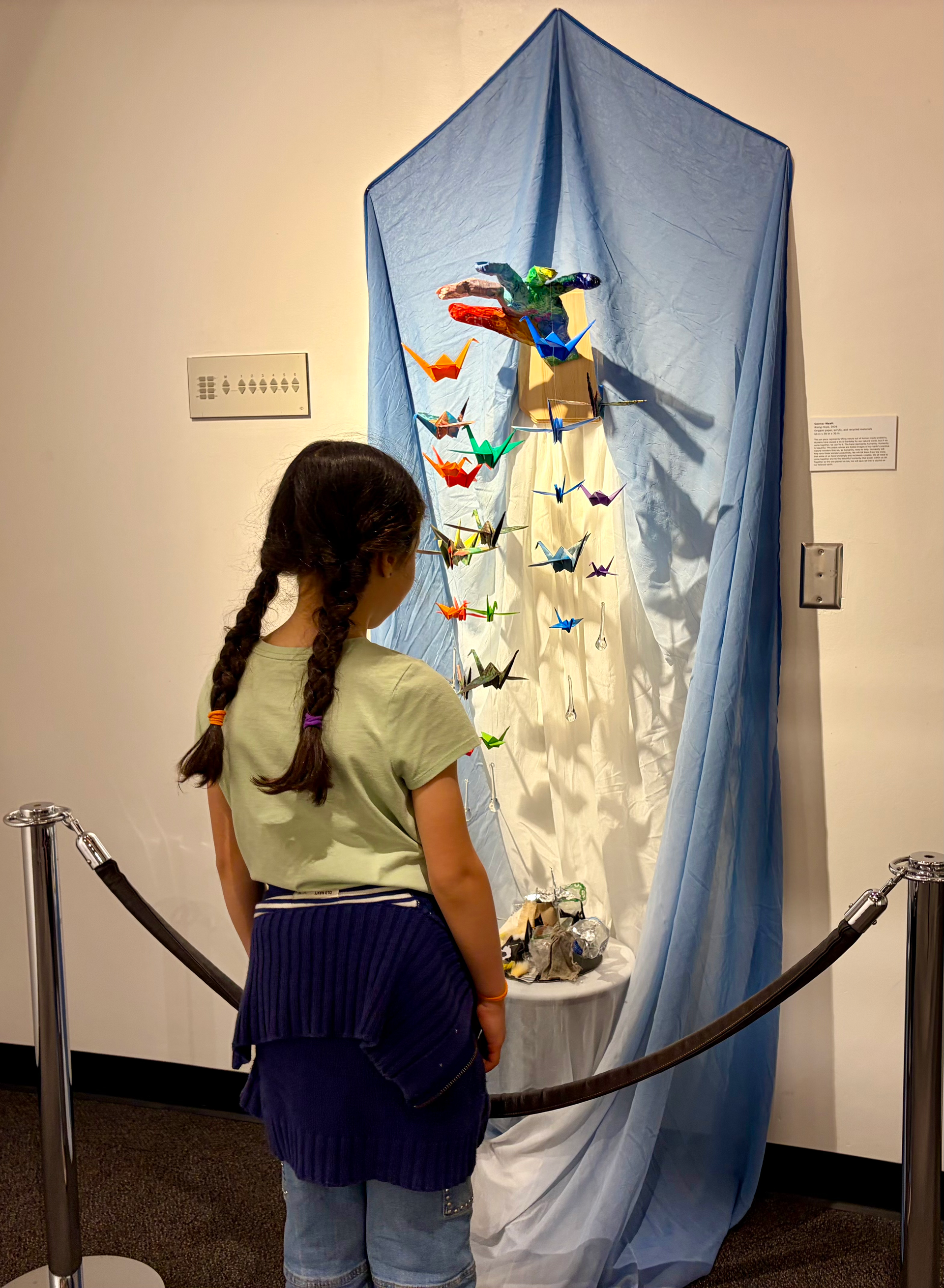A guest takes in one of the art pieces in the