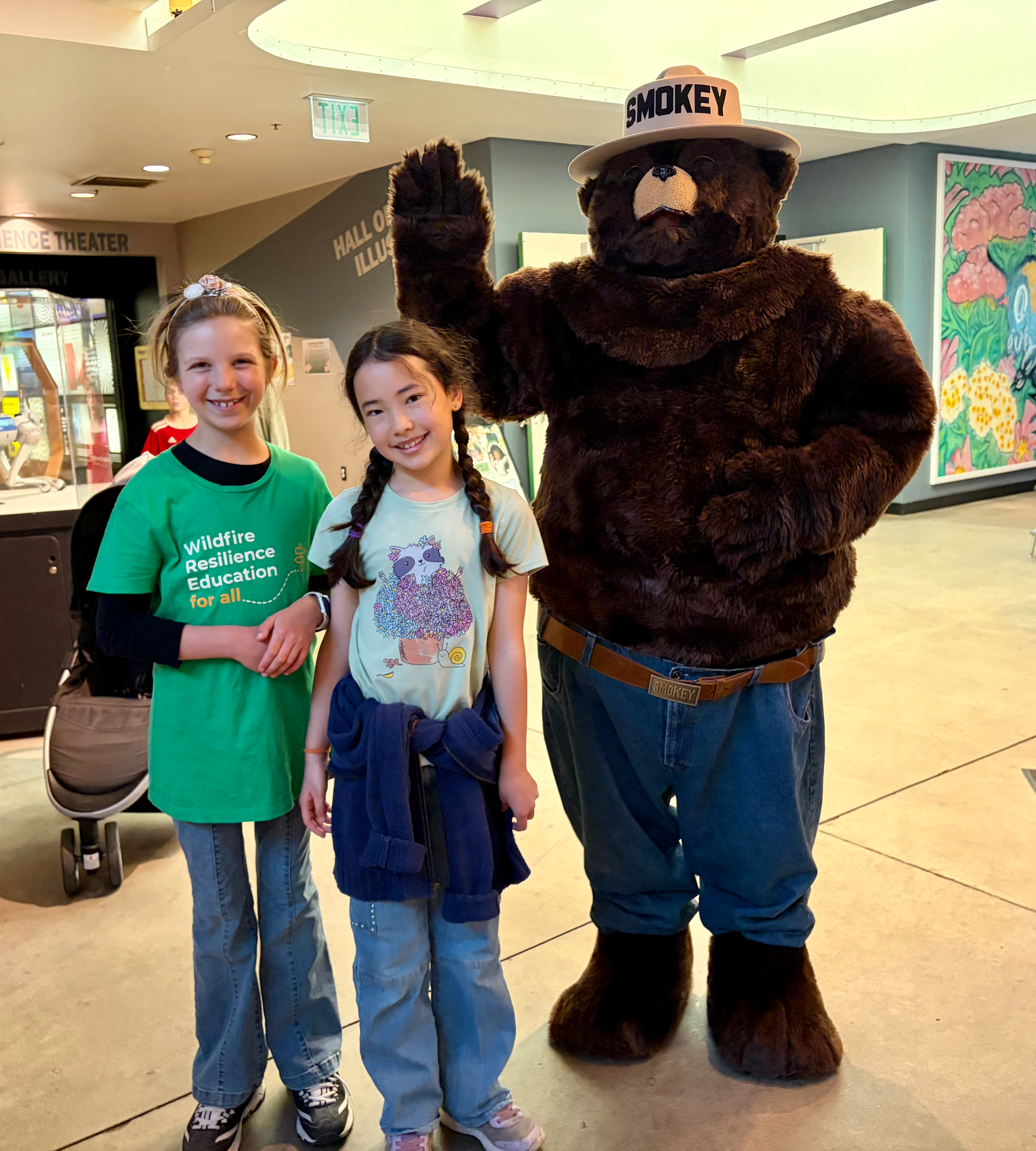Young visitors pose with Smokey Bear