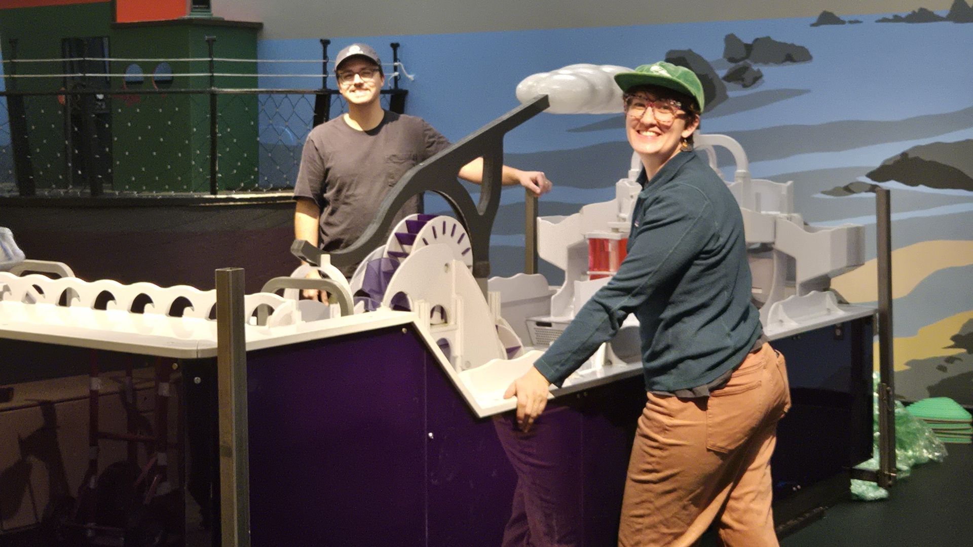 Addison and Liz pose with new water table exhibit