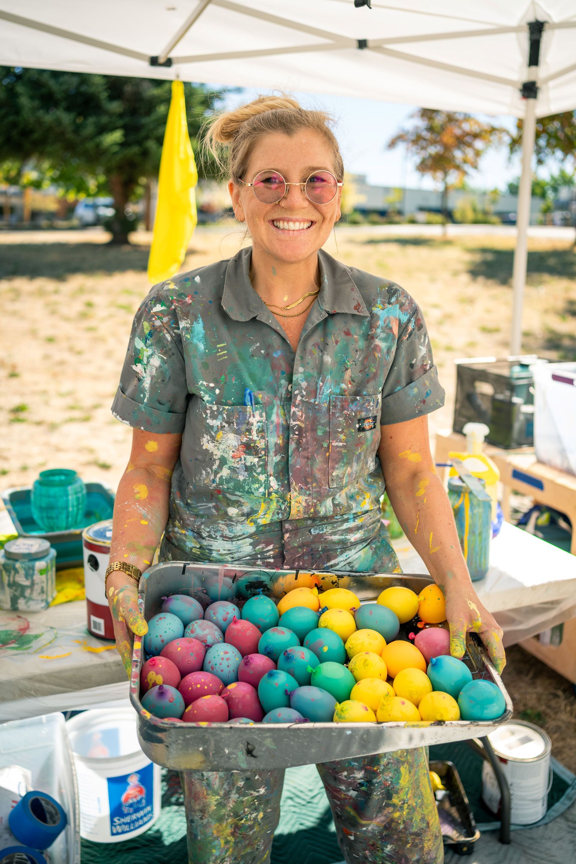 ursula barton holding a tray of paint balloons