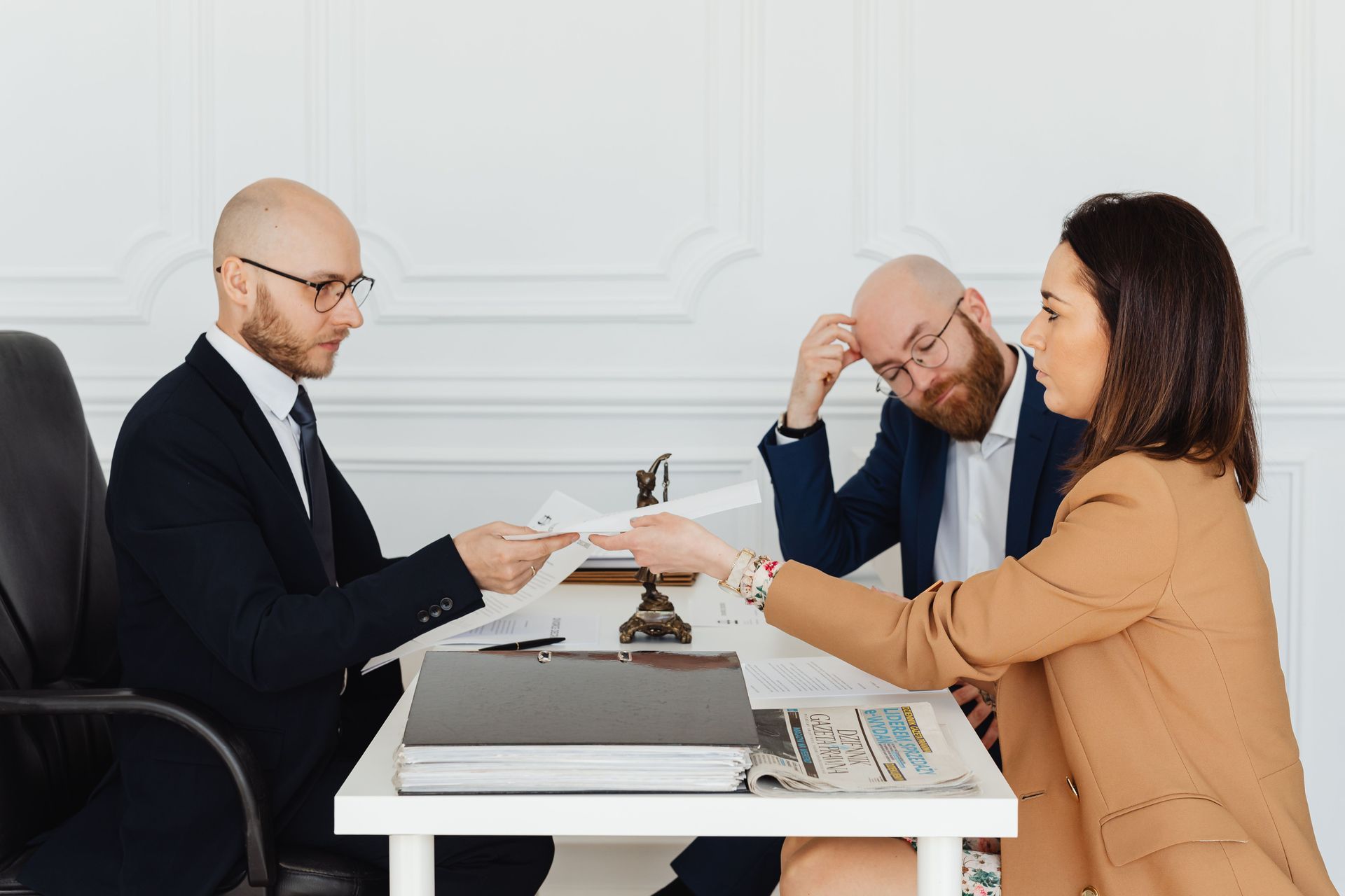 Attorney meeting with clients whose interests may conflict in a potential legal malpractice matter
