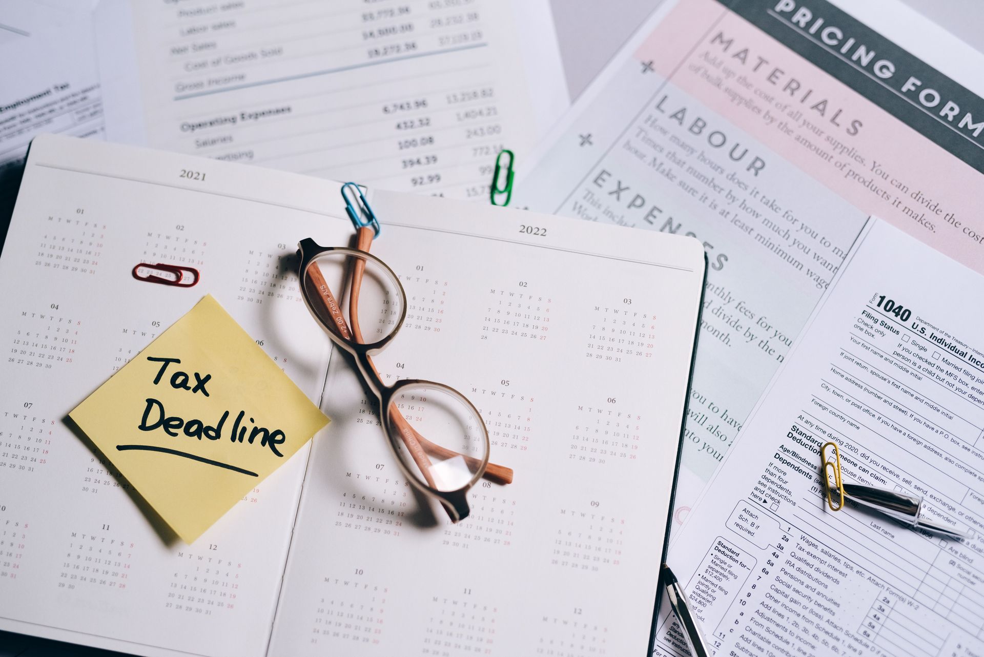 Calendar with a sticky note reading Tax Deadline