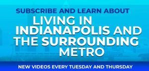 A blue sign that says subscribe and learn about living in indianapolis and the surrounding metro