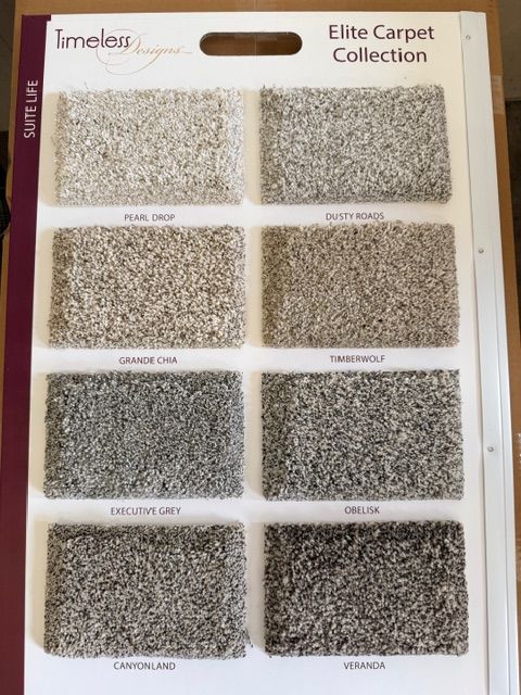Carpet sample board labeled “Elite Carpet Collection” with eight beige and gray textured swatches