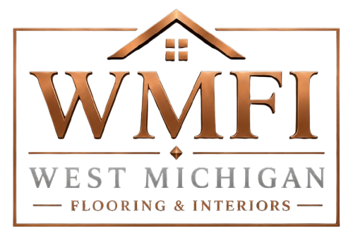 WMFI logo in copper and gray with a house roof, reading &ldquo;West Michigan Flooring & Interiors&rdquo;