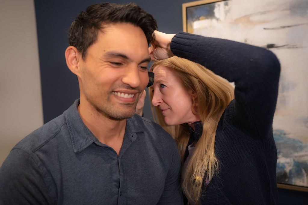 Cora Mattie, founder & physician associate at Balanced Healthcare, interacting with a male patient