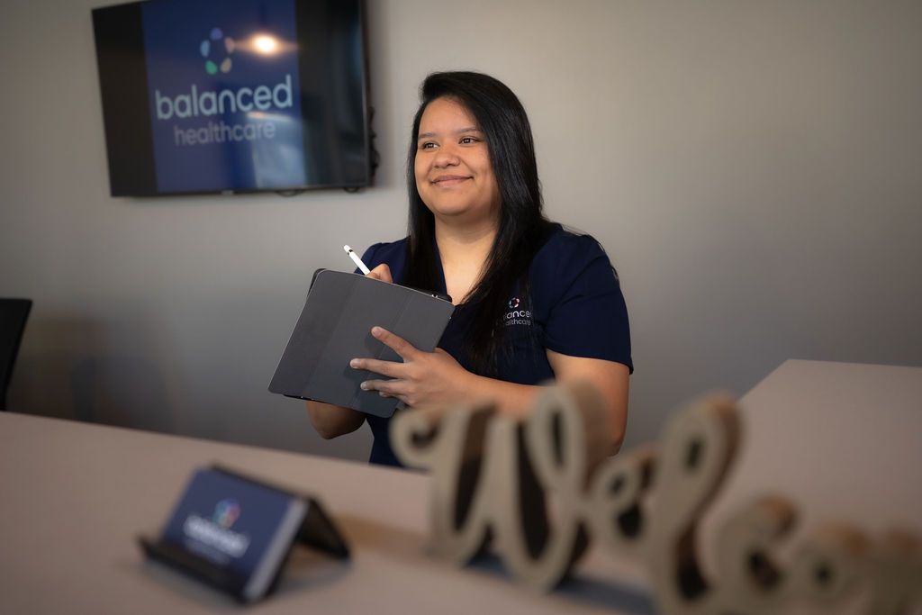 Estefany Garcia, medical assistant at Balanced Healthcare, at front desk