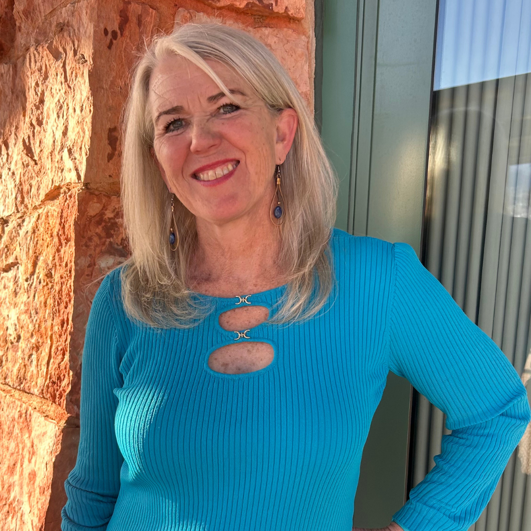 Rebecca von Boeck smiling, wearing a bright blue top.
