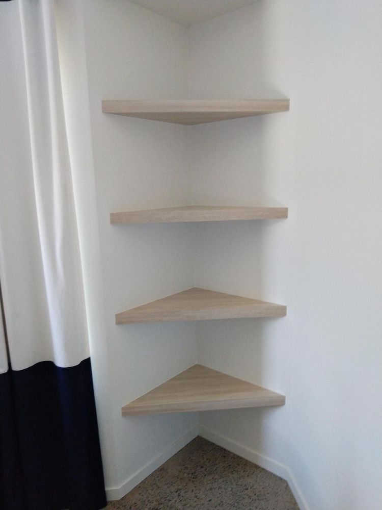 There Are Four Shelves In The Corner Of The Room — Pioneer Cabinets in Paget, QLD