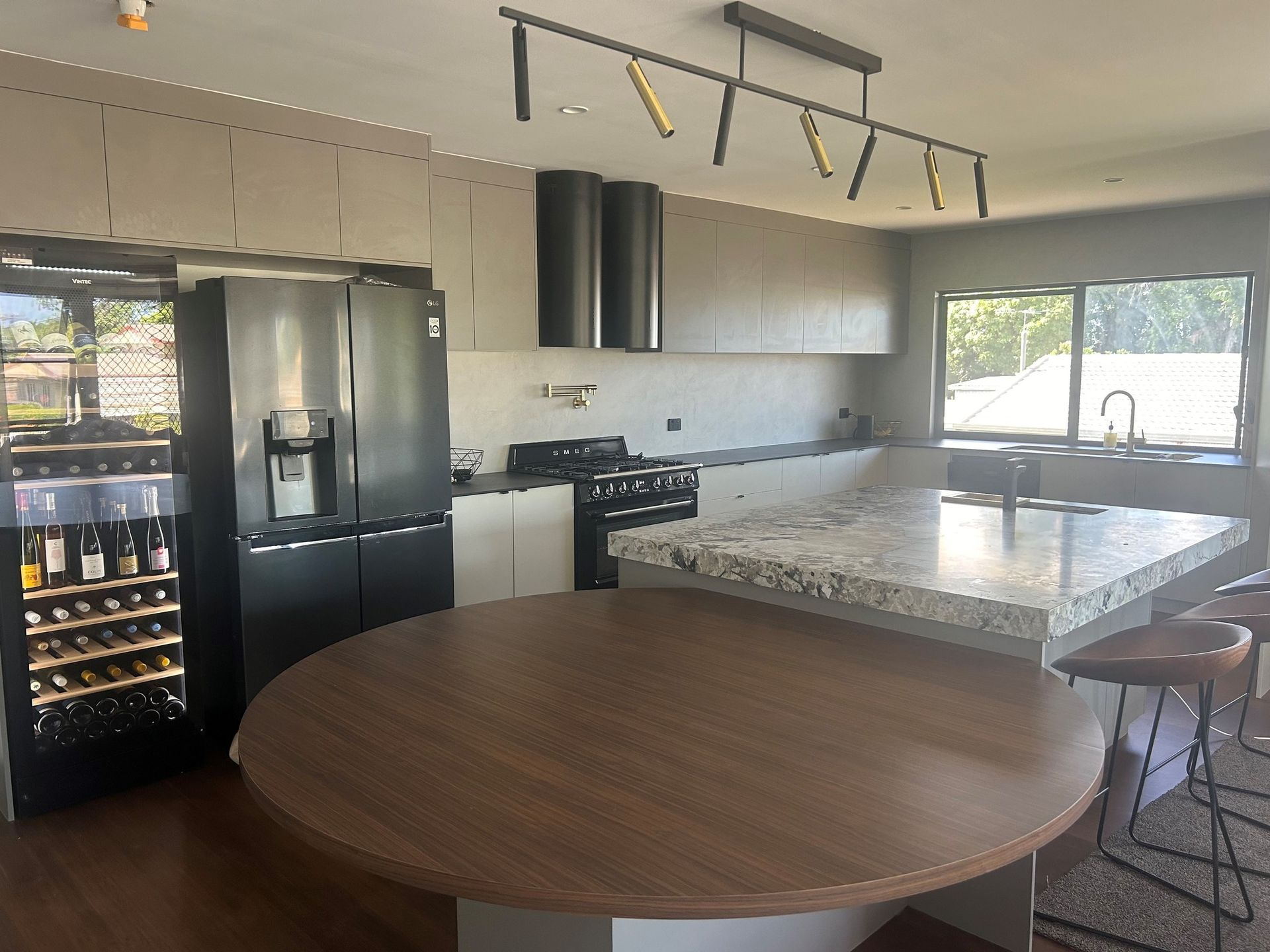 A White Sliding Door Wardrobe In A Room — Pioneer Cabinets in Paget, QLD