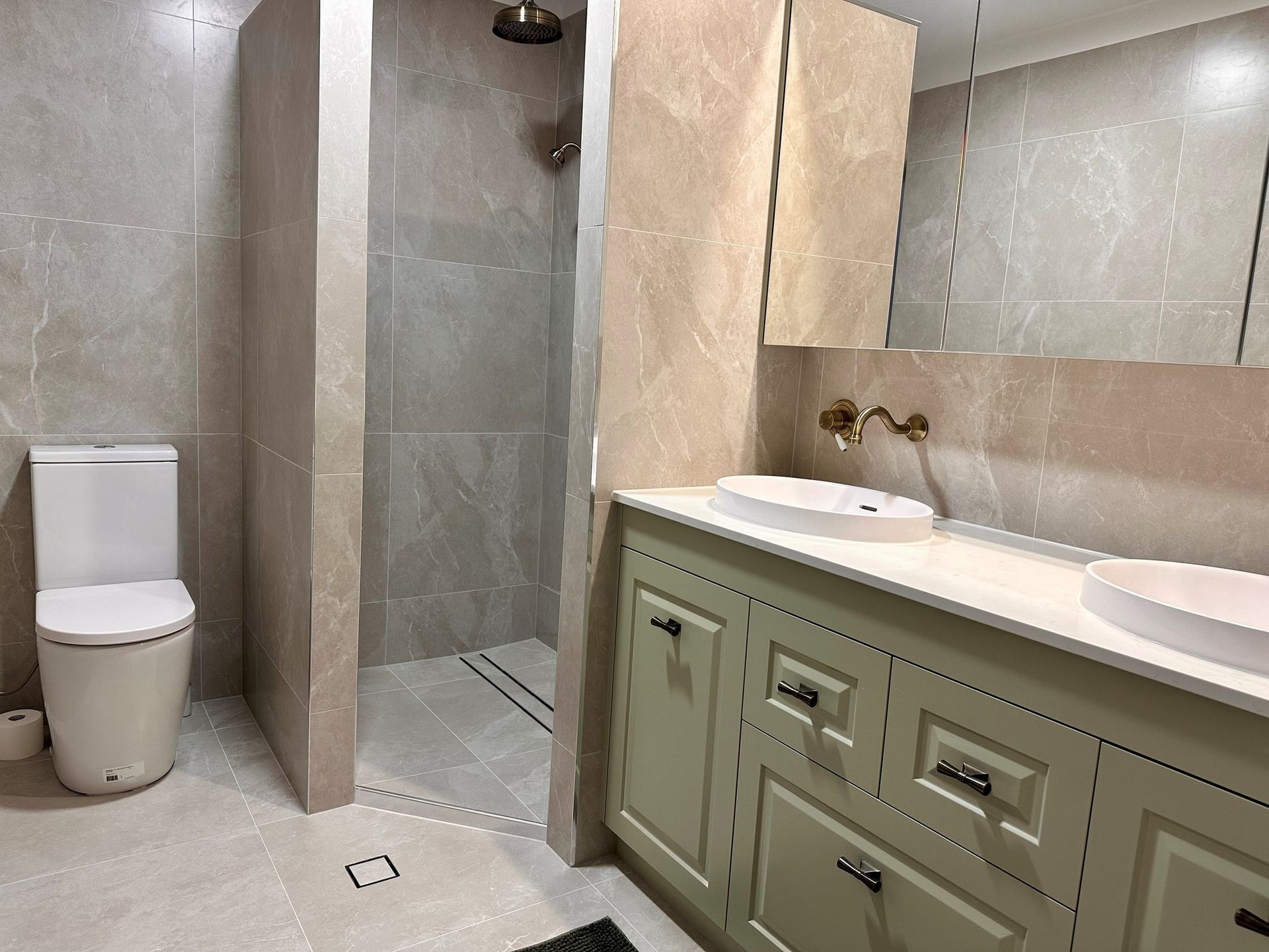 A Bathroom With Two Sinks And Two Mirrors — Pioneer Cabinets in Paget, QLD