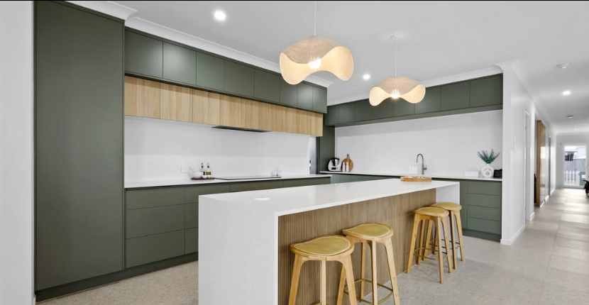 A Living Room With White Cabinets And Glass Doors — Pioneer Cabinets in Paget, QLD