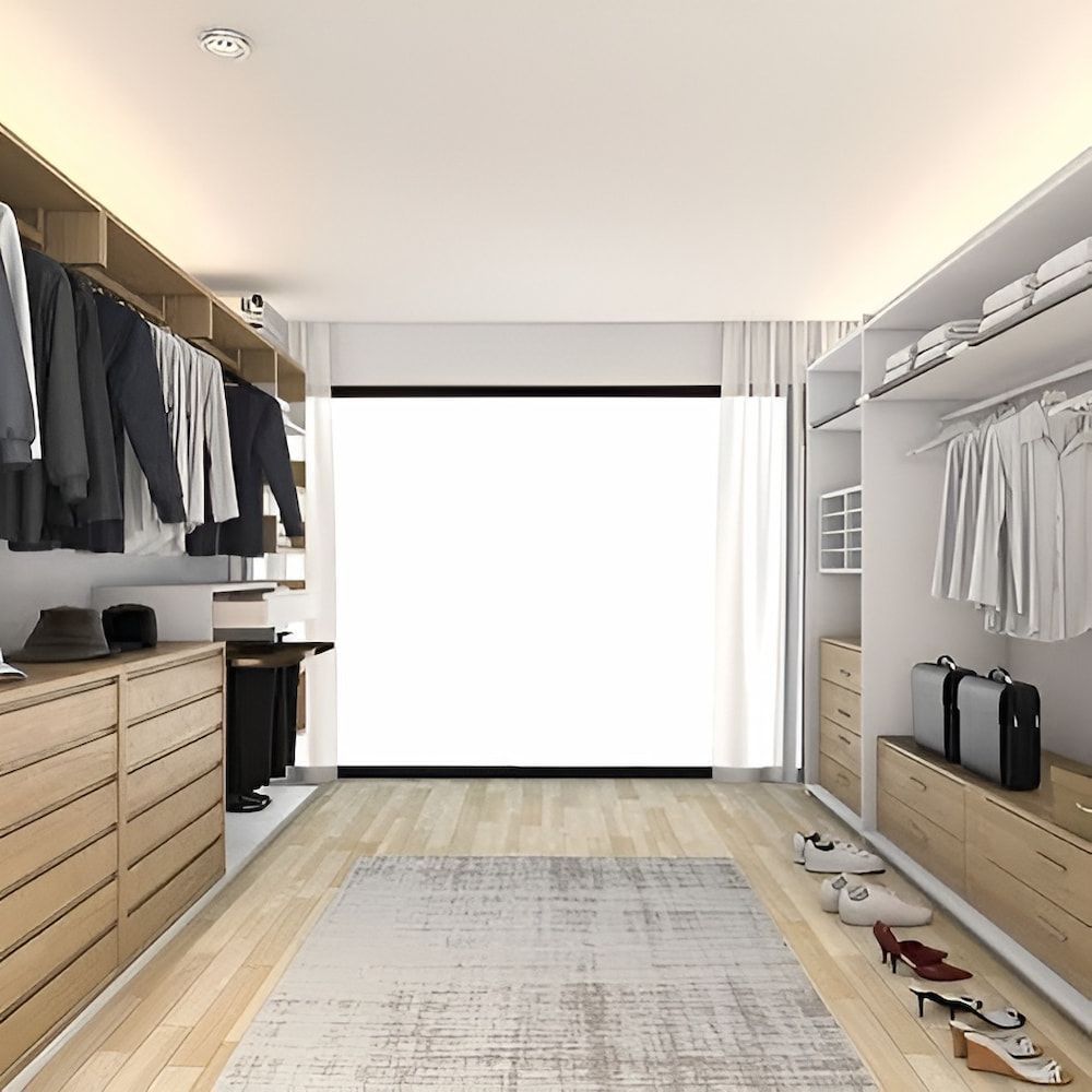 A Walk In Closet With Lots Of Clothes And Shoes — Pioneer Cabinets in Moranbah, QLD