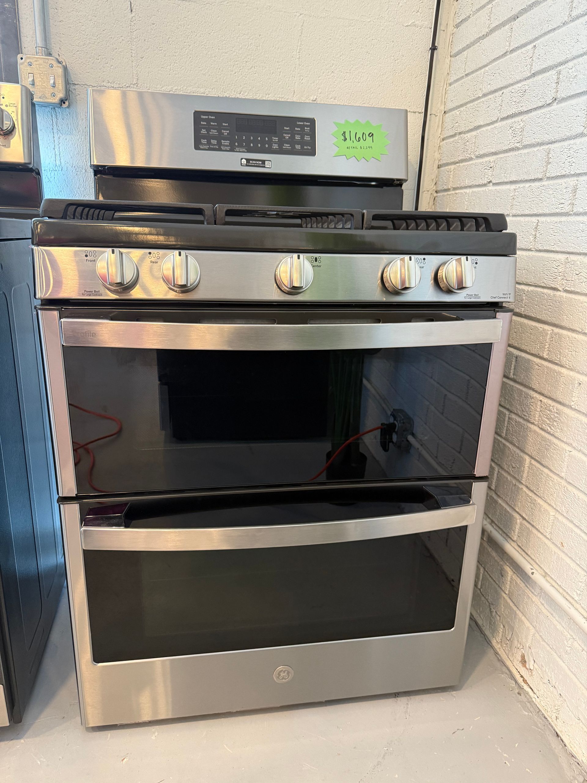 A stainless steel stove with a label that says live on it