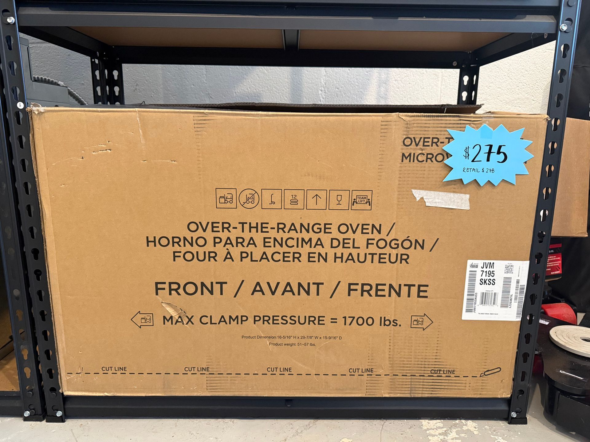 A cardboard box that says over the range oven on it