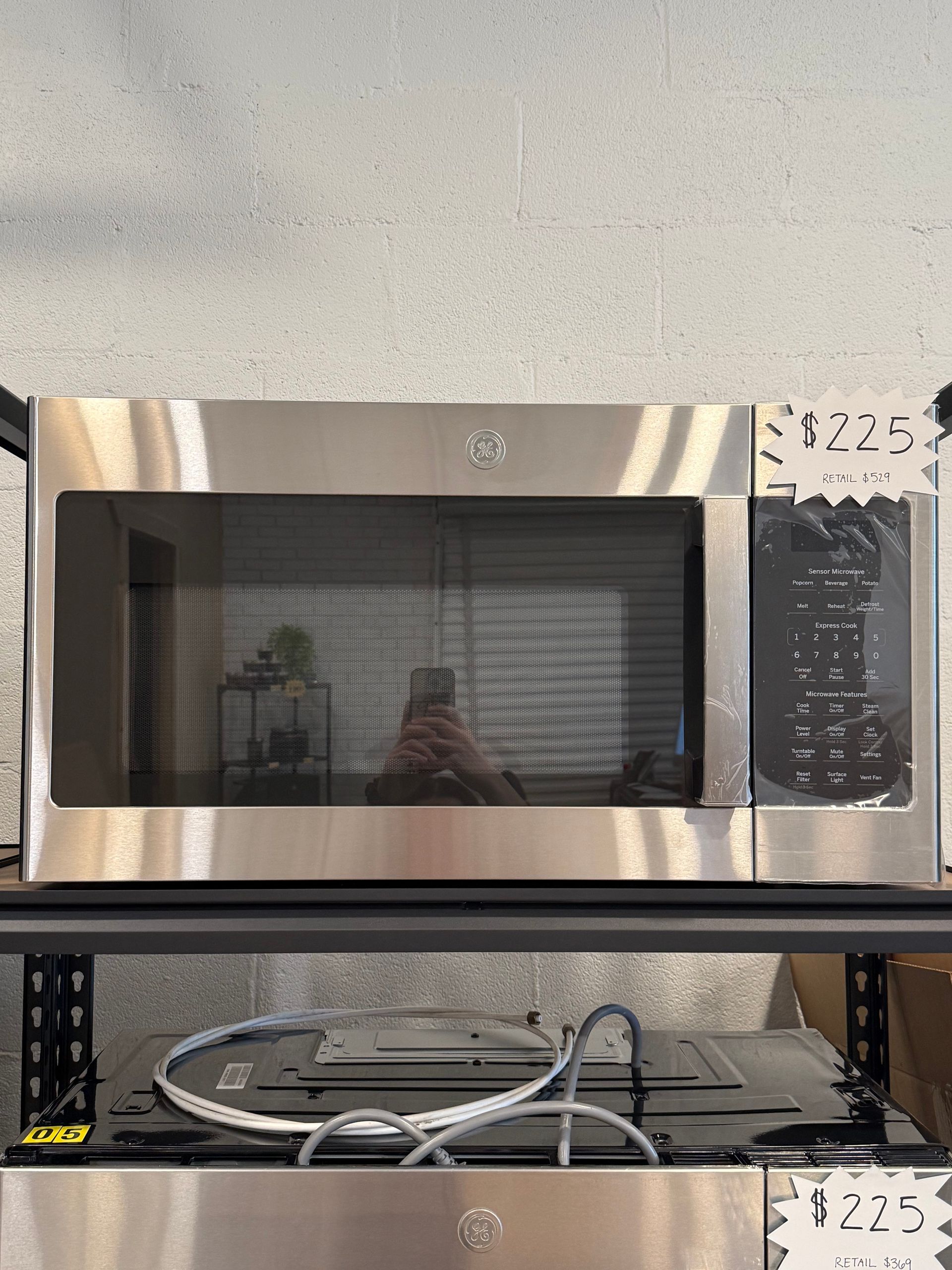 A stainless steel microwave oven with a price tag of $ 225