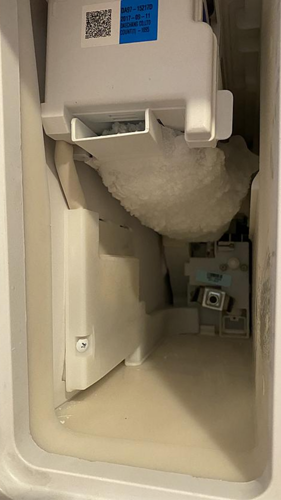 The inside of a refrigerator freezer filled with ice.