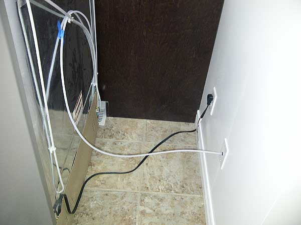 A bunch of wires are connected to a wall