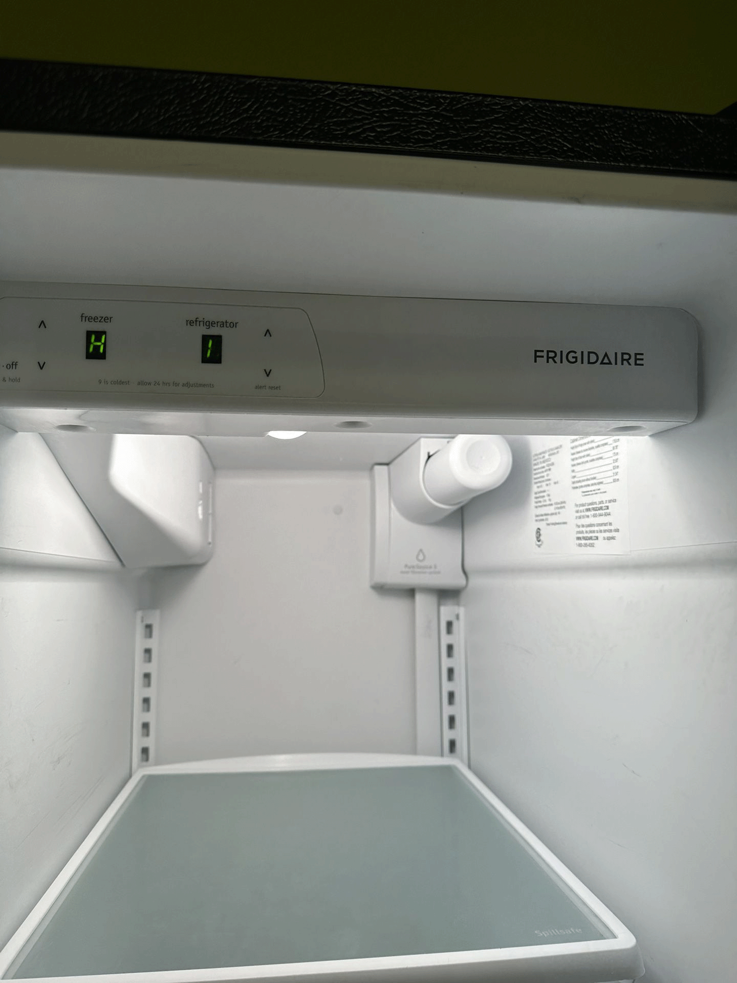 The inside of a frigidaire refrigerator with the door open