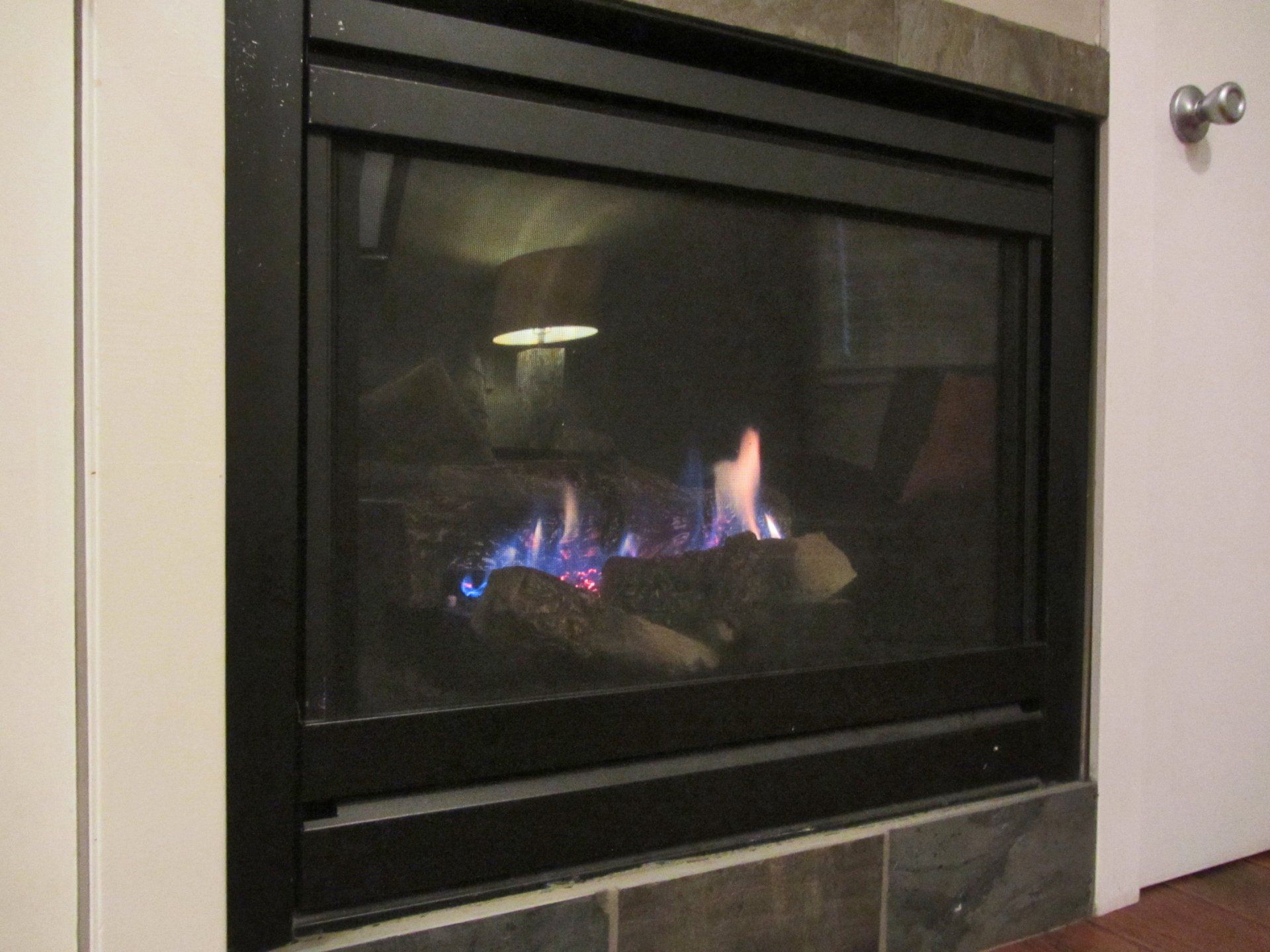 A fireplace with blue flames coming out of it