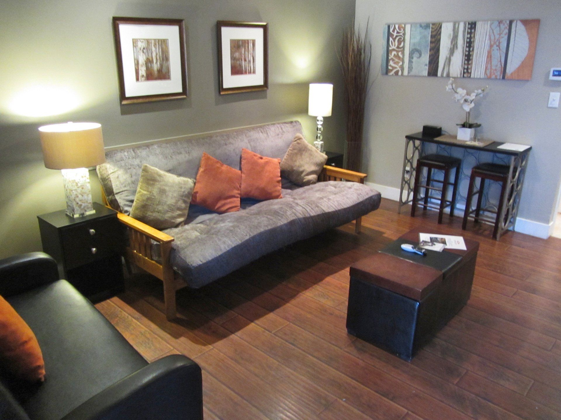 A living room with a couch a chair and a coffee table