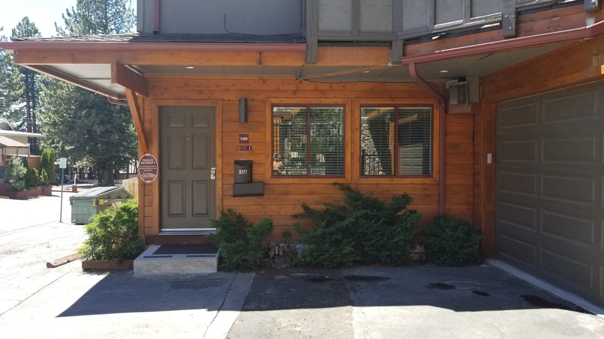 The front of a house with a gray garage door