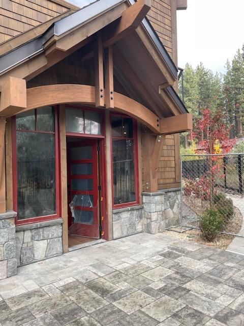 A building with a red door and a brick wall