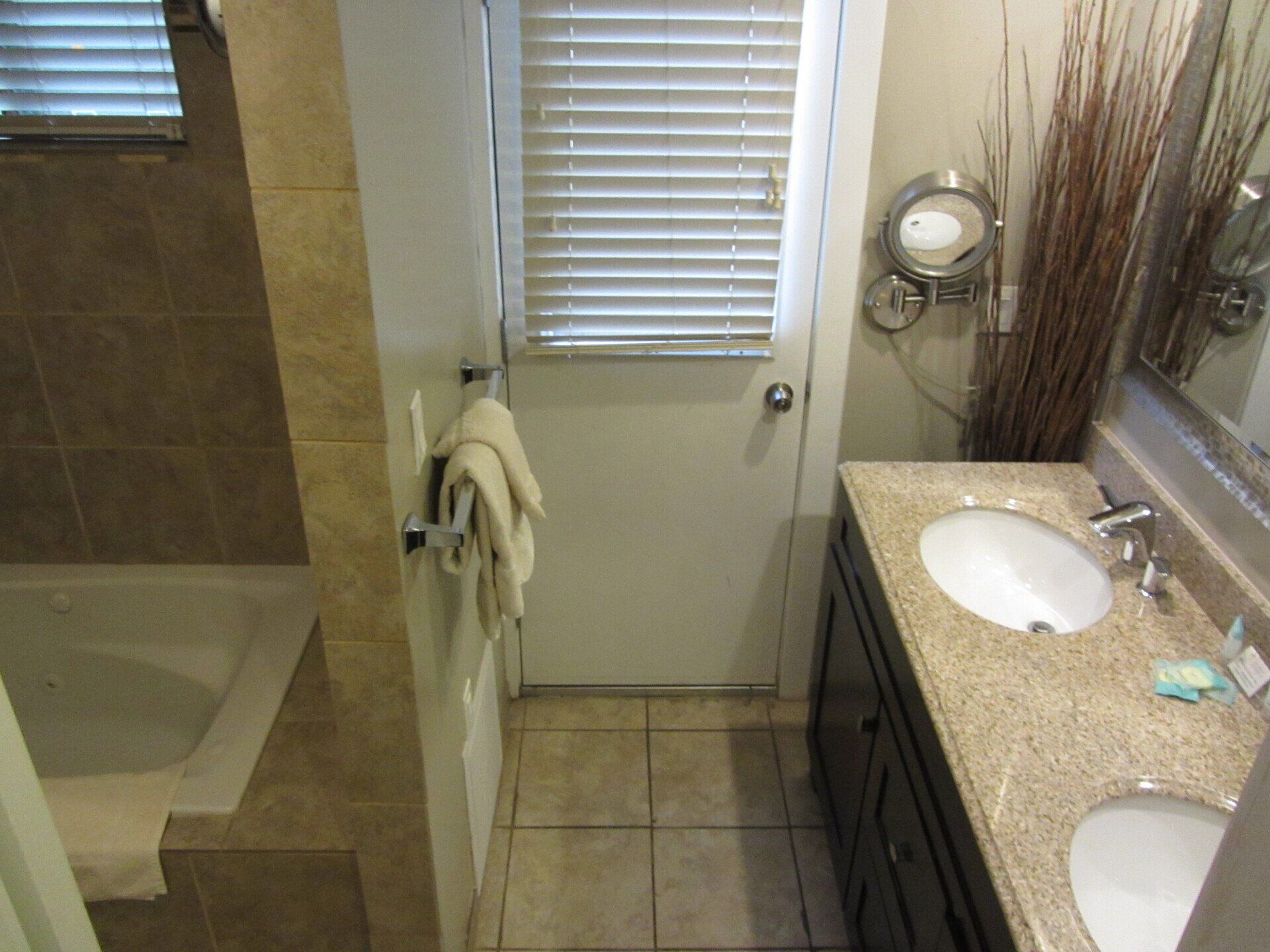 A bathroom with two sinks and a mirror