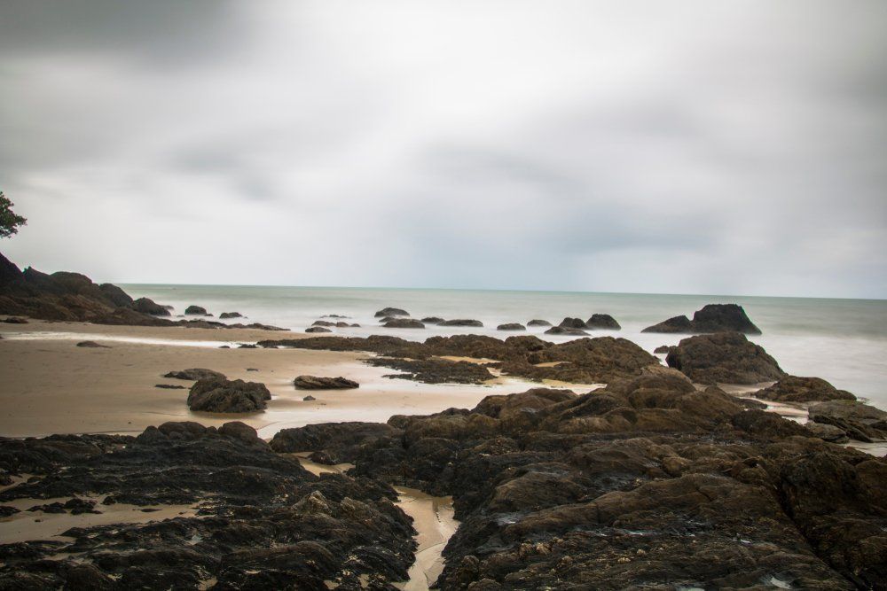 A Rocky Beach with A Cloudy Sky in The Background — NQ Parks and Gardens in Innisfail, QLD