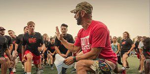 coach teaching football