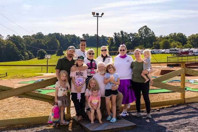The Shenandoah Valley Campground team with camping families at the mini-golf course