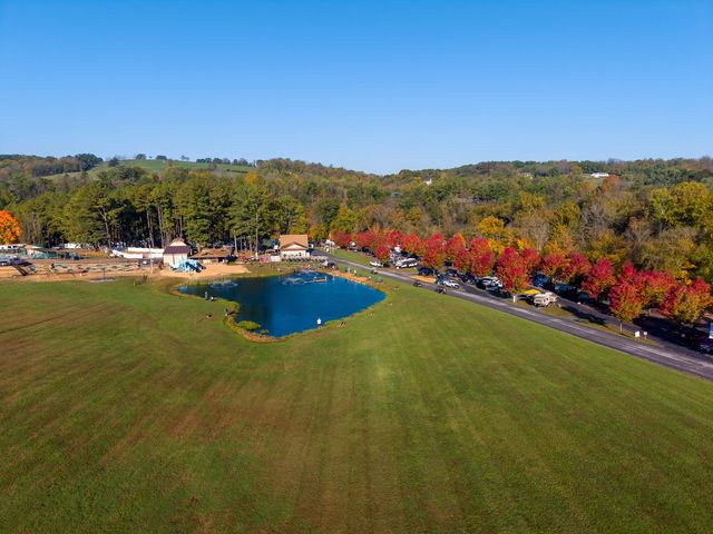 Aerial view of the campground pond, fountains and rows of red maples in October