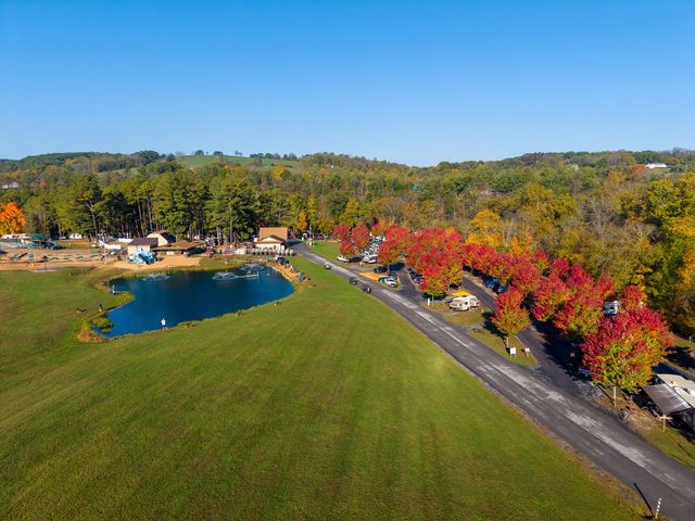 Fall view across the pond toward the camp store and red maples