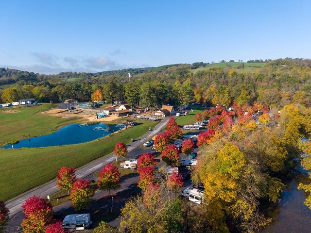 Red maples lining the RV sites beside the pond