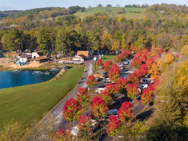 Aerial of the pond, camp store and RV loop in fall color