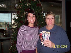 Two women standing in front of a christmas tree on december 23 2008