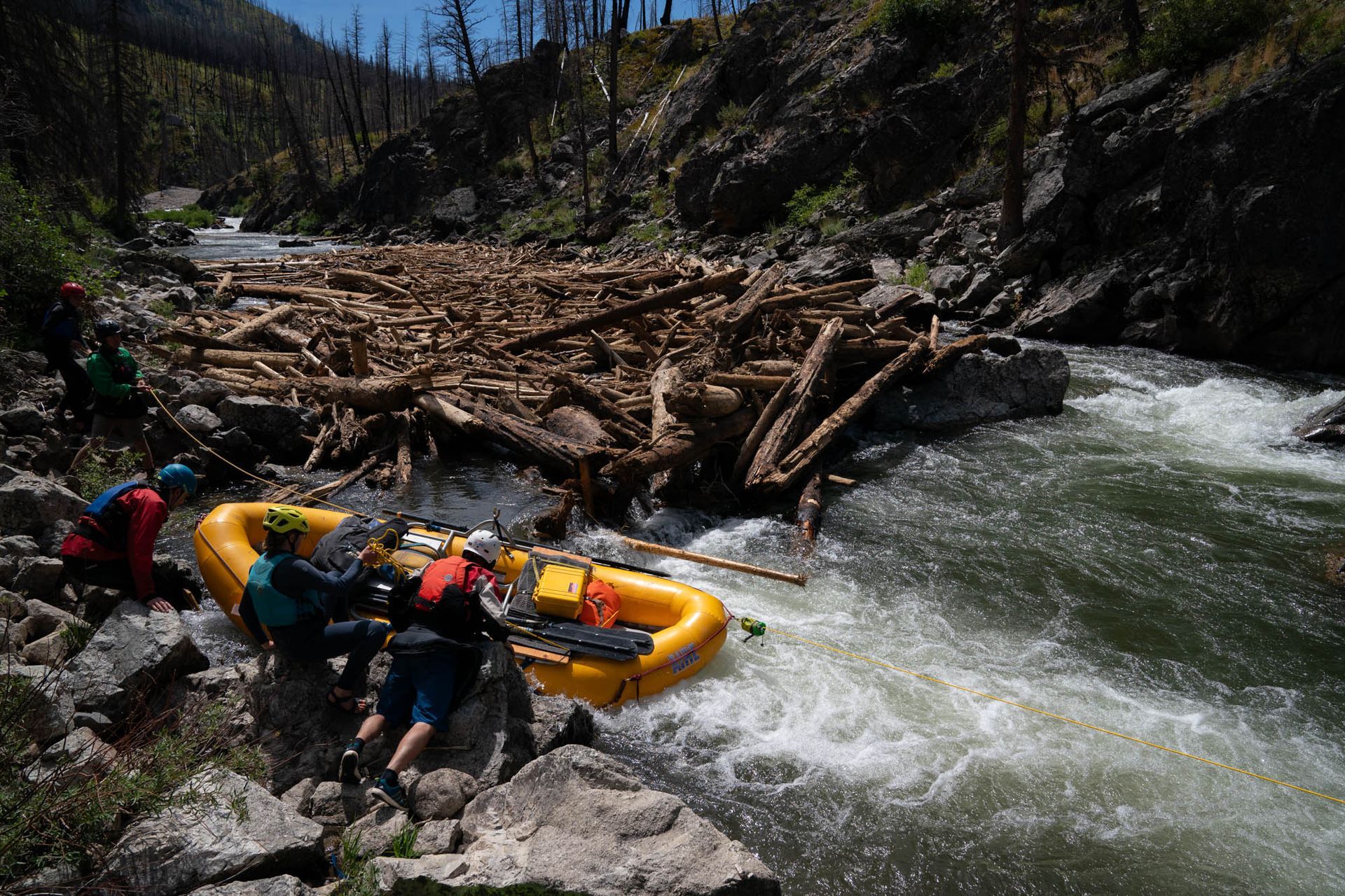 portaging a raft on the middle fork of the salmon river after recent blowouts